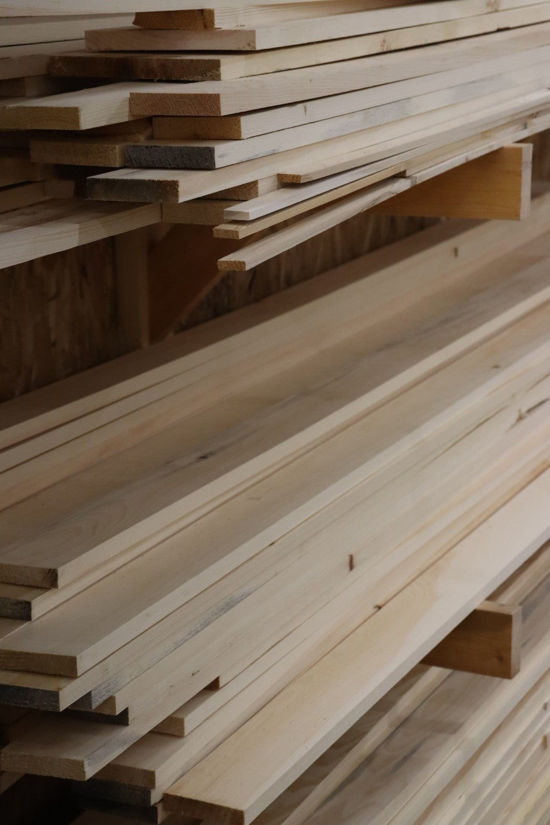 Ontario grown boards stacked on the lumber rack in the Sip Saunas shop